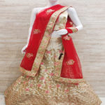 Ivory lehenga choli with golden n baby pink thread work